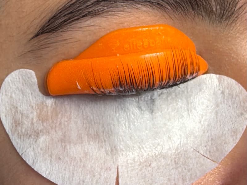 Close up of lashes set on a silicone shield during a lift